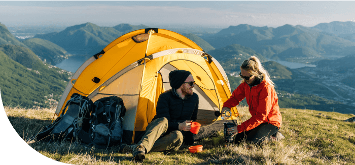 Man and woman camping in the mountains.