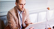 Person viewing documents at an airport.