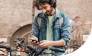 Man easily adds Discover card to Apple Pay while sitting on bike.