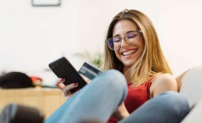 woman holding debit card