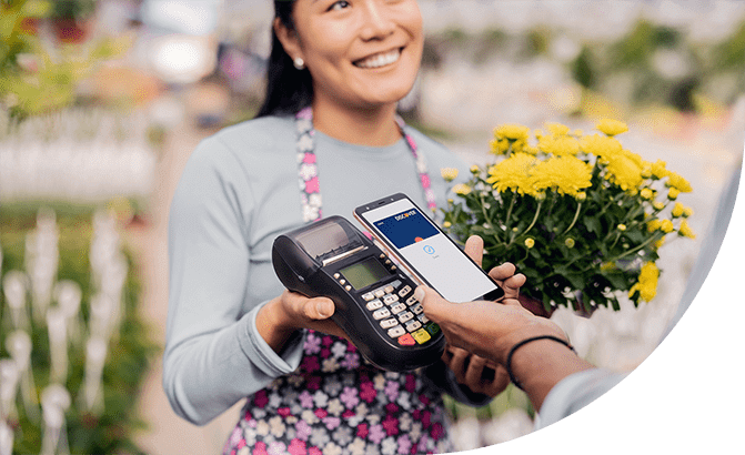 Man accessing digital wallet to pay for flowers.