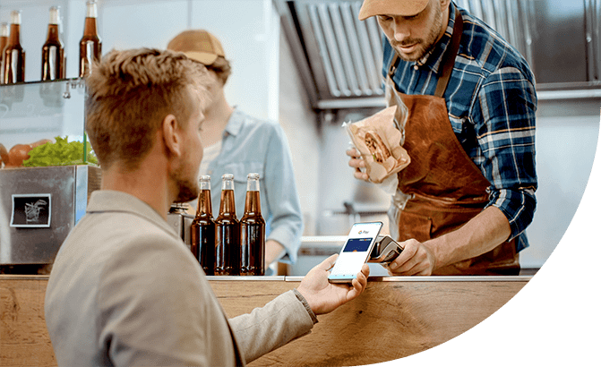 Man buys sandwich at deli with Google Pay.