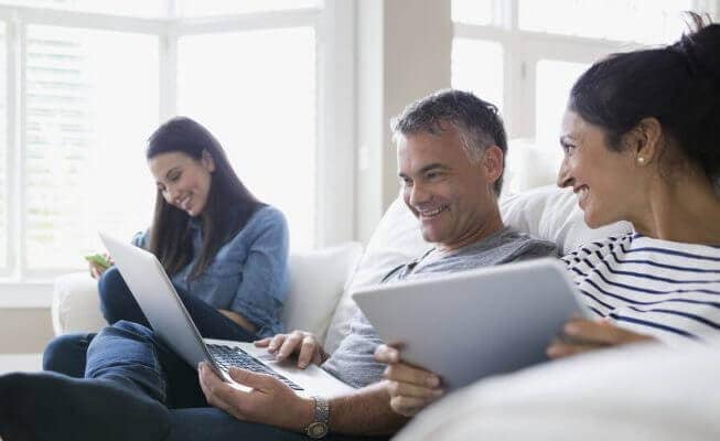 Man and woman viewing their money market account online.