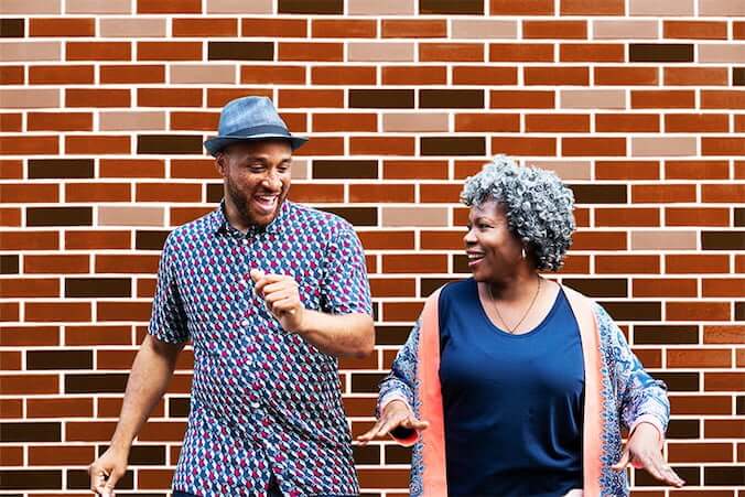 Mother celebrates her upcoming retirement by dancing with her son.