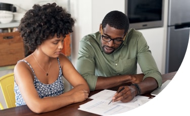 Parent with student at desk