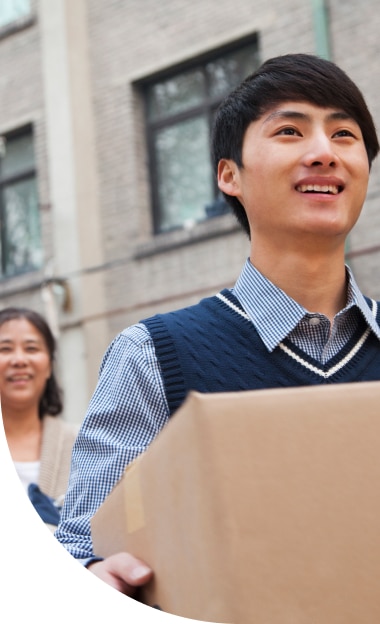 Parent helping student with moving boxes