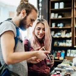 Young traveling couple look at items in a shop