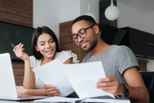 A man and a woman reviewing paperwork