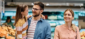 Father carrying baby with wife