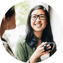 Woman enjoying coffee purchased with rewards Credit Card