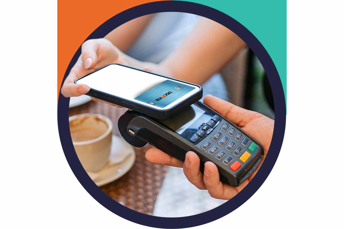 Smiling man holding a mini doughnut