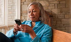 Woman using her mobile device.