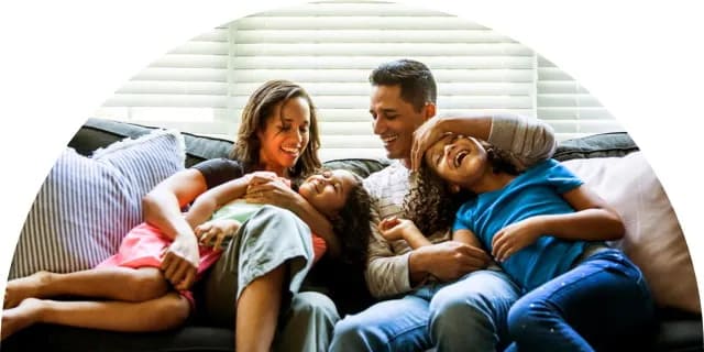 Image of family having fun together on the couch