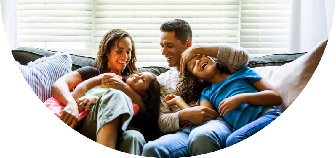 Image of family having fun together on the couch