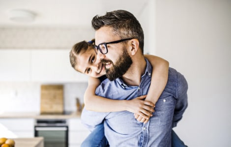 Image of a father playing with his daughter
