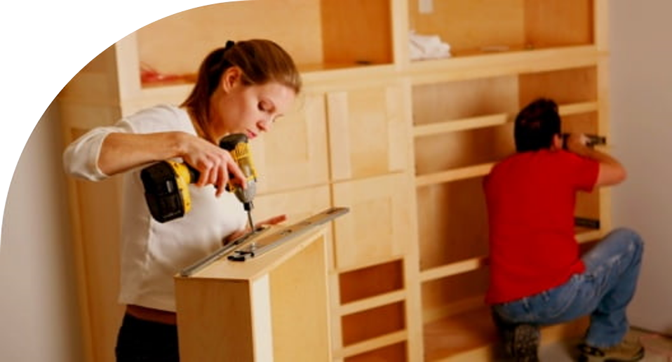 Image of couple building cabinets