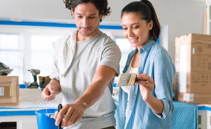 Two people painting
