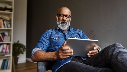 Man looking at a tablet