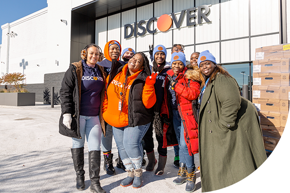 Discover employees standing in a group at the Chatham Customer Care Center, wearing company-branded gear.