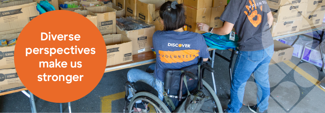 Discover employee sitting in conference room and smiling at two other employees, overlaid with a solid orange circle that says, "Diverse perspectives make us stronger".