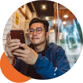 A man looks at his mobile phone.