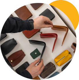 Close-up on man shopping for a new wallet.