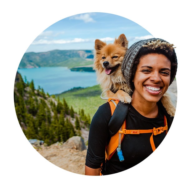 Woman hiking with her dog