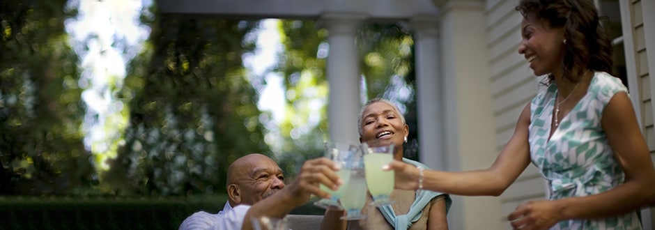 Family celebrating great HELOC rates with a toast.