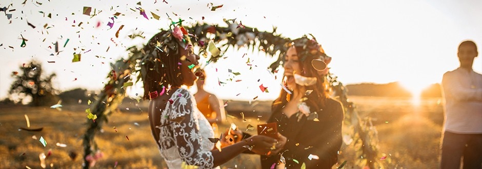 Couple smiling and celebrating at the alter at their dream wedding