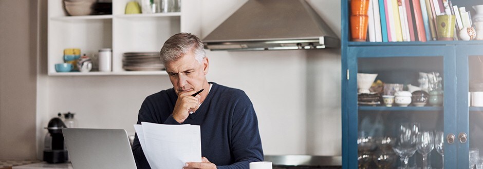 Man looking at his credit score and taking steps to getting his finances in order.