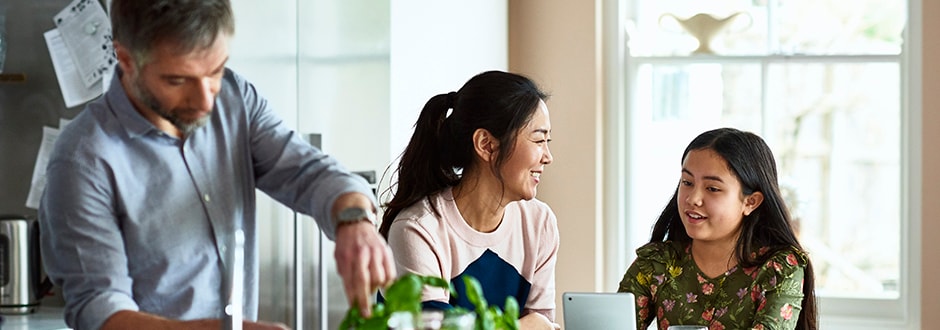 Family in their home discussing taking out a home equity loan and what the requirements are