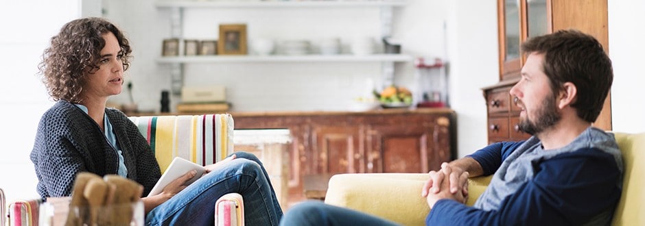 Couple discussing what is a HELOC and comparing them to home equity loans