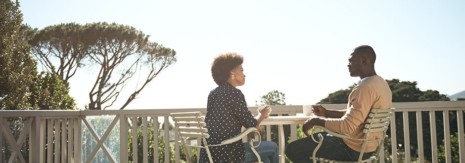 Couple enjoying their new deck after they got a loan to remodel their home.