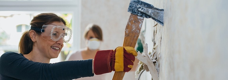 Woman begins a bathroom remodel project attempting to increase her home value.