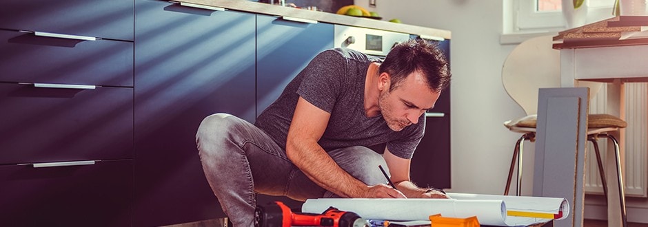 Young man completing his kitchen renovation to increase his home equity