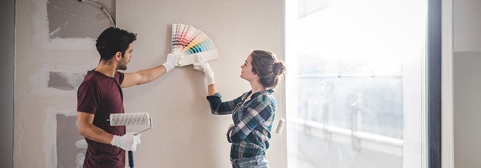 Couple expanding their home with a home equity loan to increase their home value.