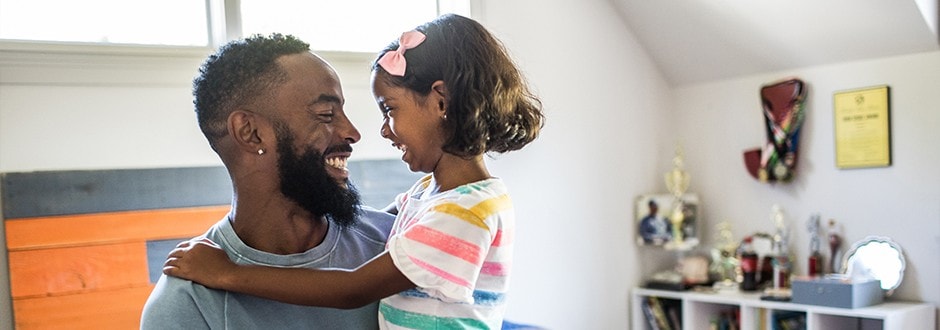 Self-employed man with his young daughter celebrating after getting a mortgage approval