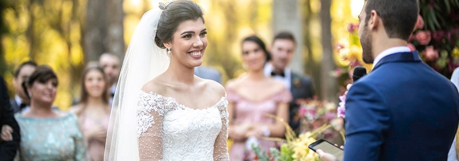 Two brides standing at the alter with the perfect engagement ring