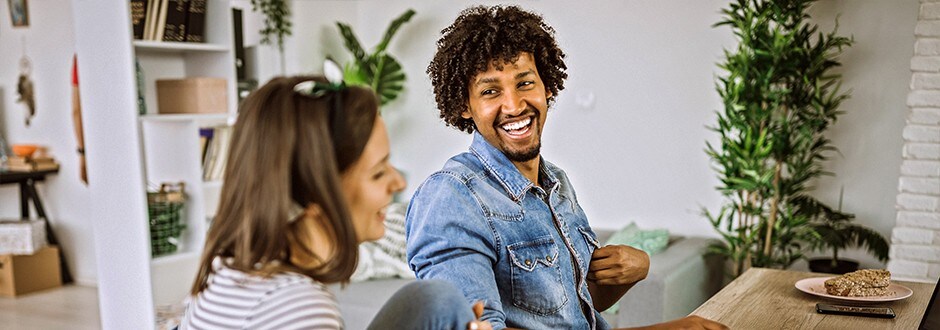 Couple at a desk considering a home equity loan to purchase a new car