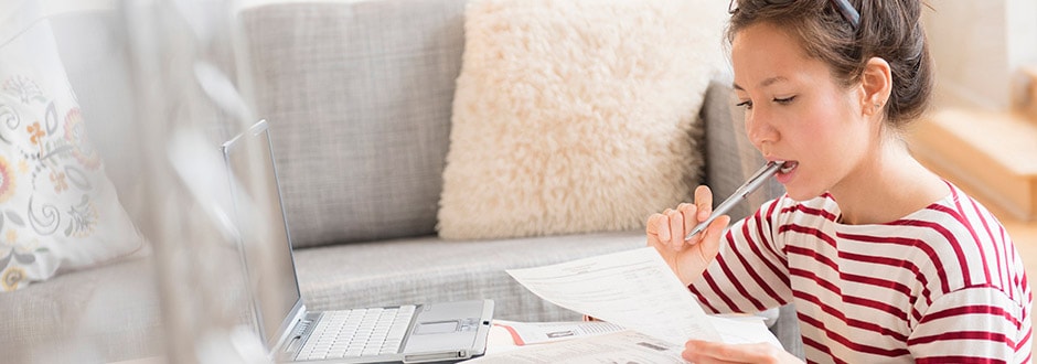 Woman evaluating and considering if she should use her home equity to pay for her unexpected medical expenses