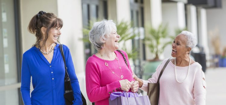 Three retired women shopping