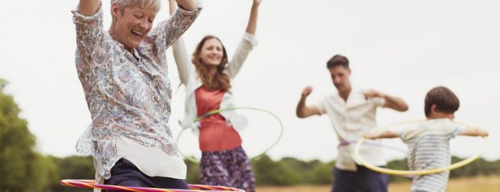 A group of people hula hooping.