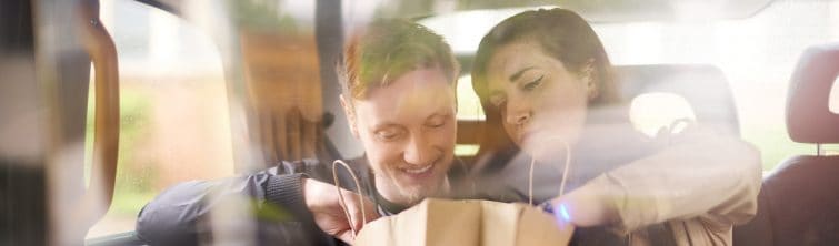 Couple looking in shopping bag