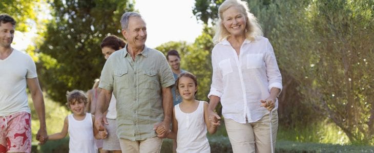 Grandparents spending time with their young grandchildren outdoors