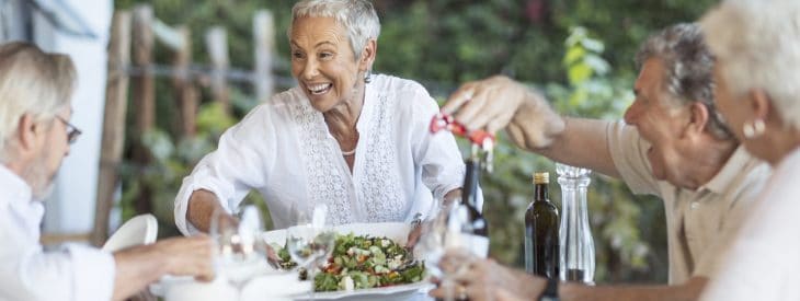 Friends enjoying their retirement with a mid-day meal