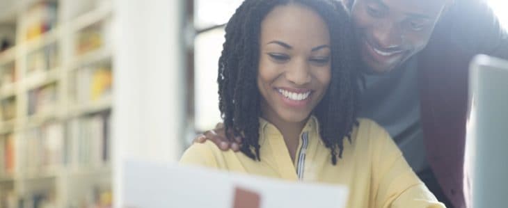 Young couple making a budget together