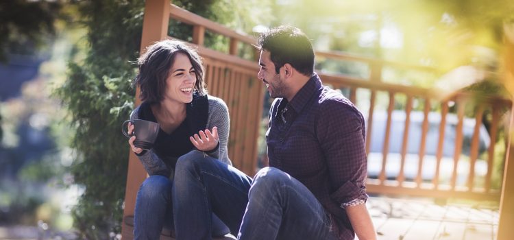 Couple discussing finances over coffee