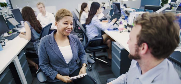 Woman getting to know her new coworkers on her first day
