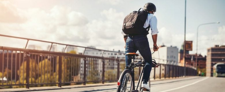 A man rides his bike to work.