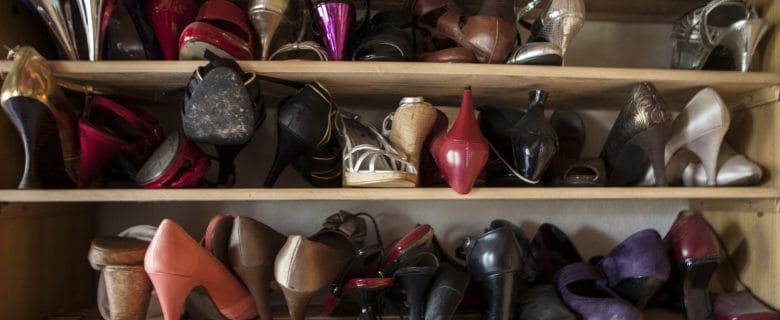 A closeup of shelves full of shoes.